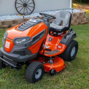 orange and black ride on lawn mower